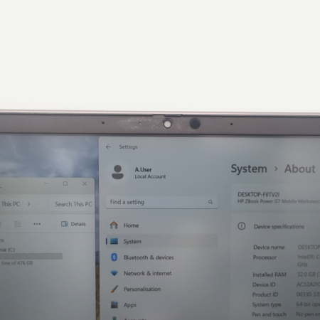 Close-up of a laptop screen showing system settings and local disk storage on Windows operating system.