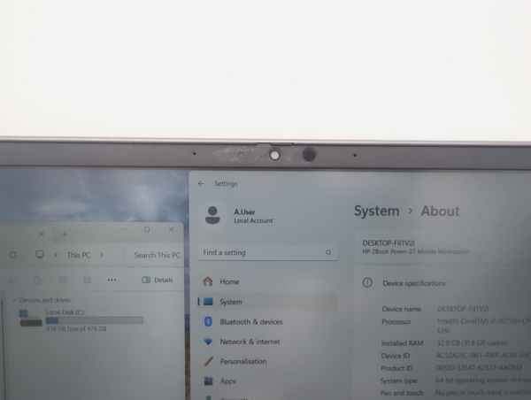 Close-up of a laptop screen showing system settings and local disk storage on Windows operating system.