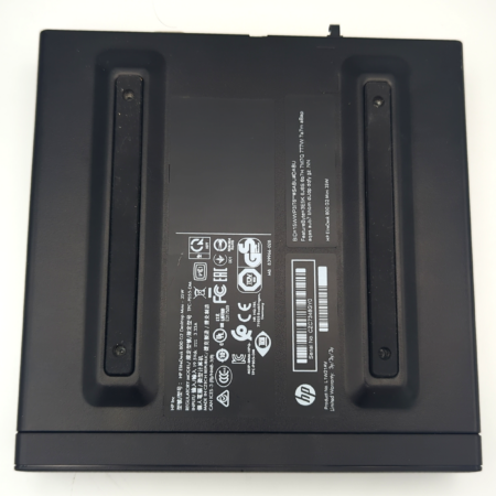 Black HP docking station bottom view, showing product labels and certification symbols on a white background.