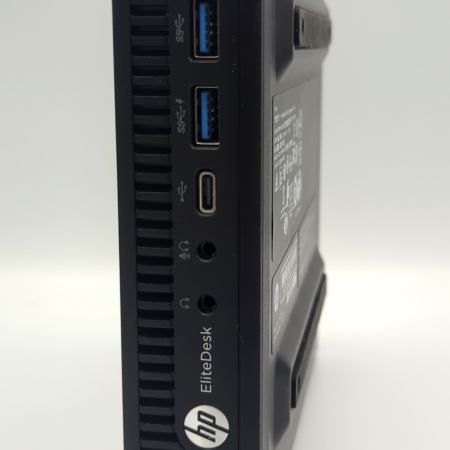 HP EliteDesk mini PC side view, featuring multiple USB ports and audio jacks.