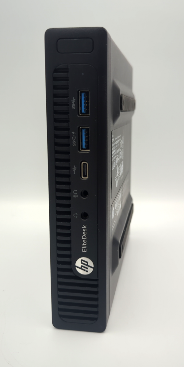 HP EliteDesk mini PC side view, featuring multiple USB ports and audio jacks.