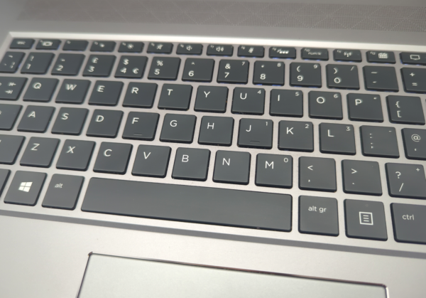 Close-up of a laptop keyboard showing QWERTY layout with function keys, perfect for typing and productivity.