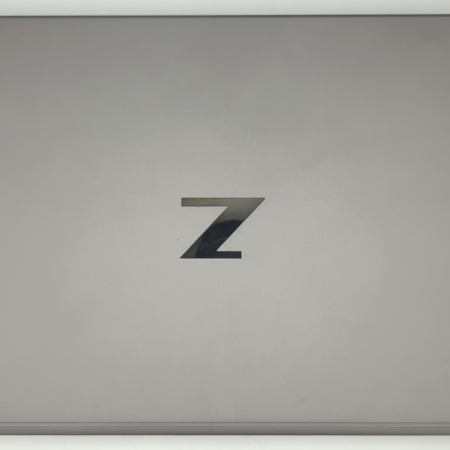 Sleek gray laptop with a Z logo on the lid, representing a modern design for enhanced productivity.