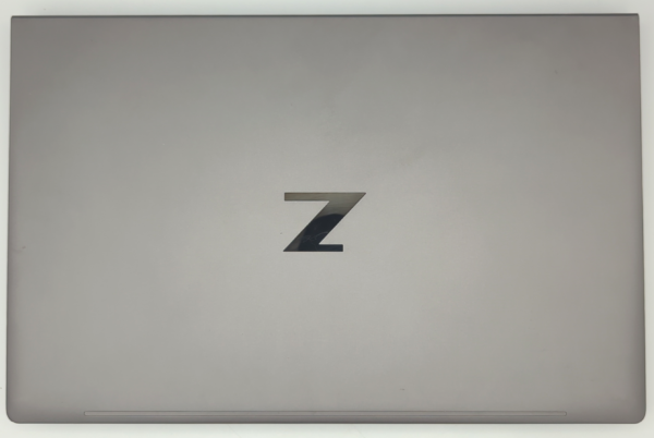 Sleek gray laptop with a Z logo on the lid, representing a modern design for enhanced productivity.