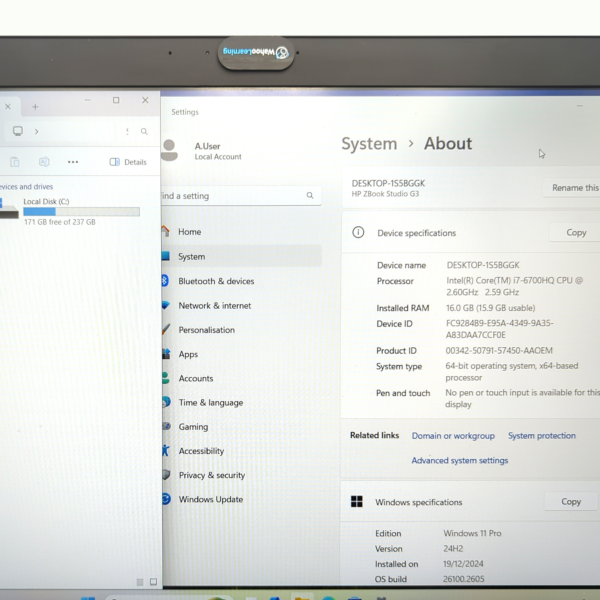 Laptop screen displaying system settings with storage and specifications in Windows operating system.