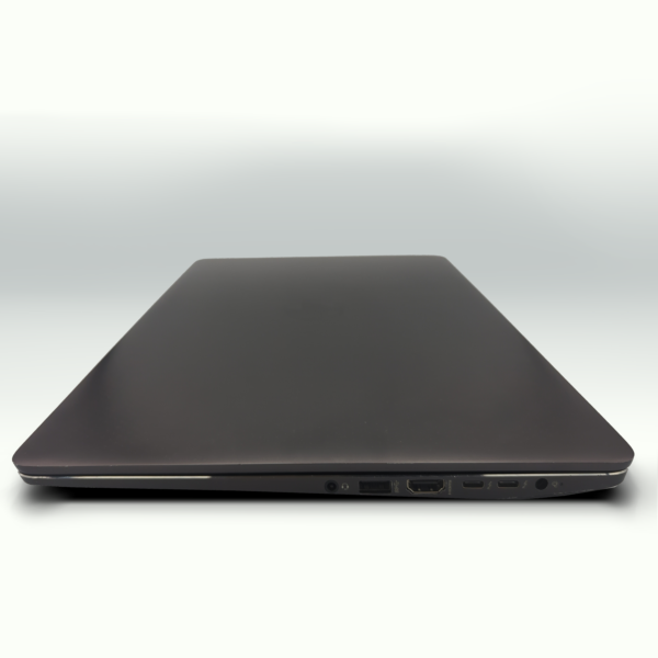 Sleek closed laptop side view with multiple ports, showcasing modern design and connectivity options.
