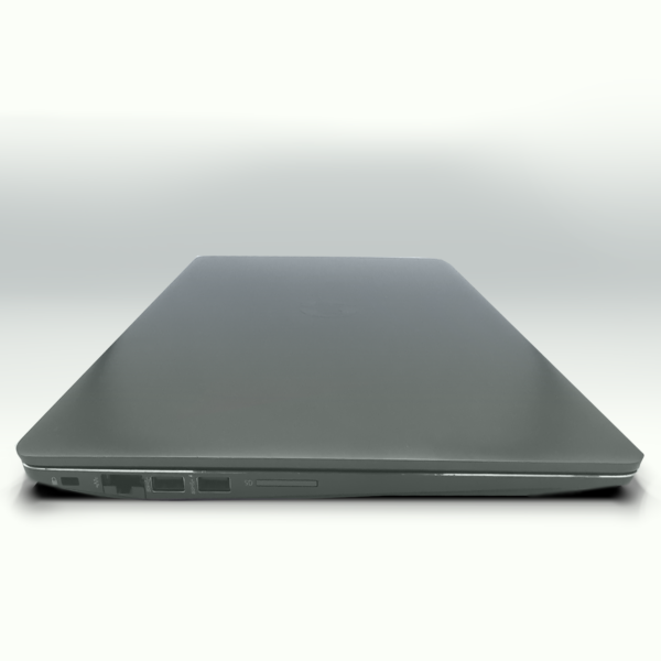 Sleek closed silver laptop with visible ports on the side, showcasing modern design and functionality.